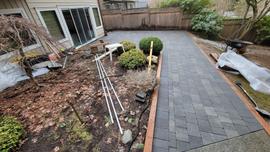 An after photo of a backyard pathway which shows new pavers; Hardscape; Installs;
