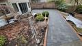 An after photo of a backyard pathway which shows new pavers